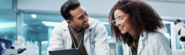 Two Doctors Chatting and Smiling