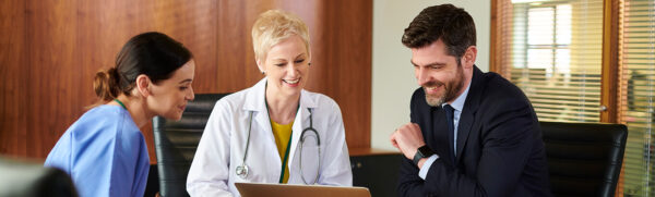 Doctors Having a Meeting About Compliance Goals