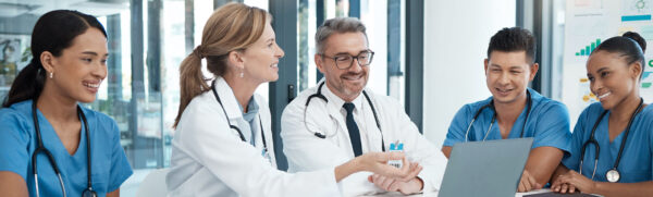 Medical Workers Smiling While in a Meeting