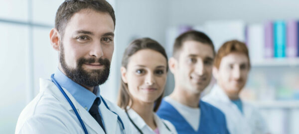 a group of doctors are posing for a picture together