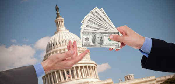 White house in the background while money is being passed from someone's hands to another's.