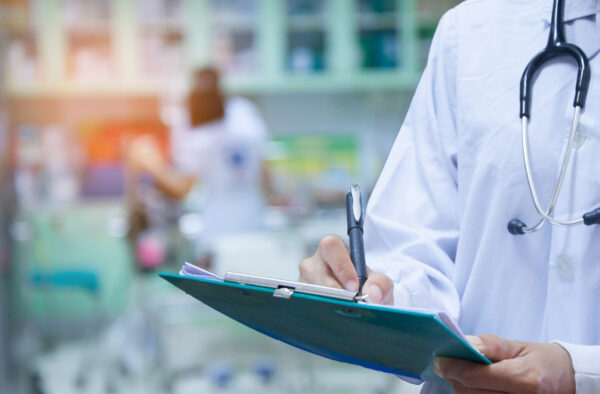 Doctor Using a Clipboard