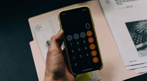 Women Holding a Calculator