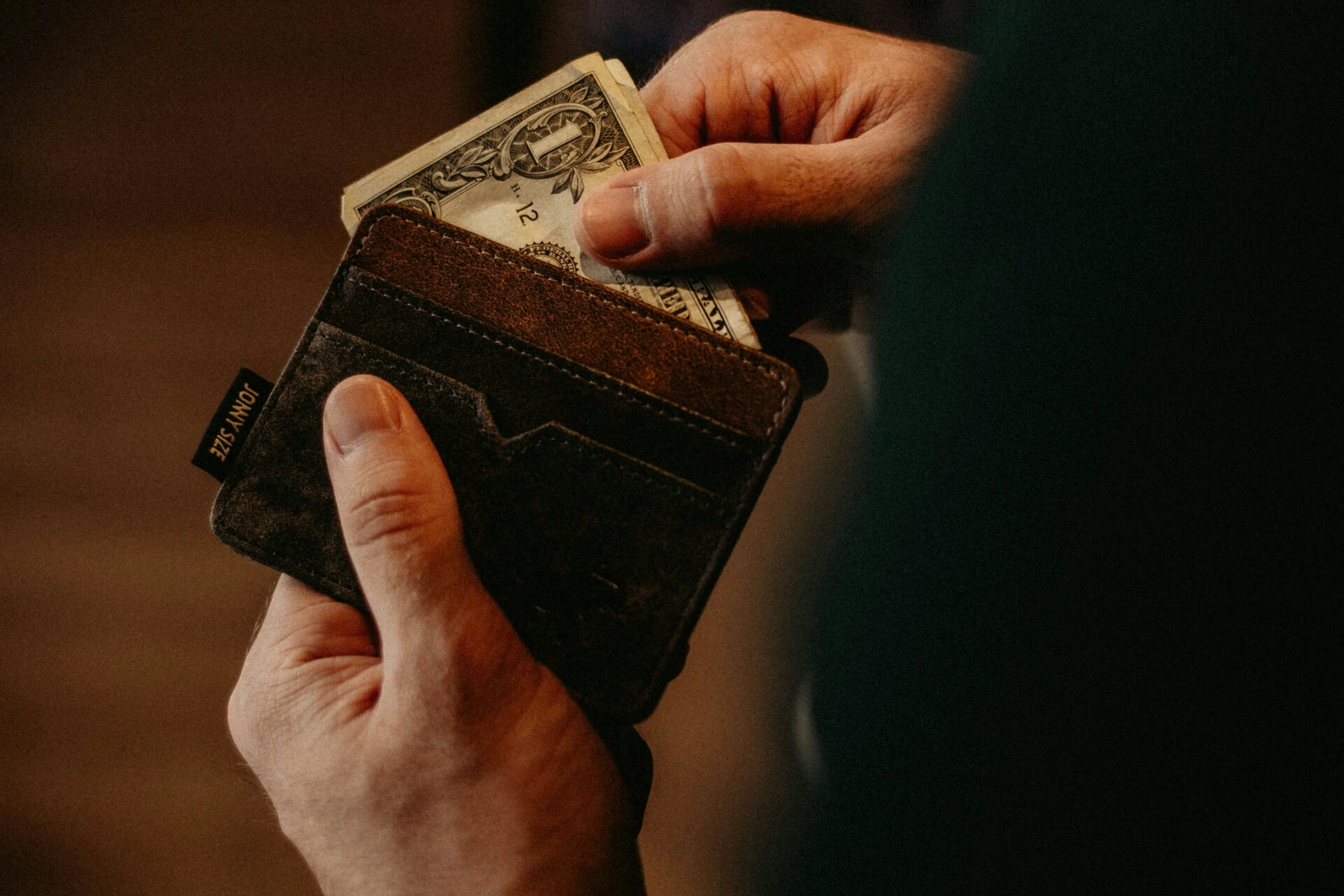 Person Paying With Cash