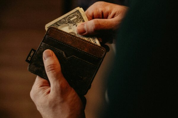 Person Paying With Cash