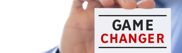 a person is holding a card that says game changer