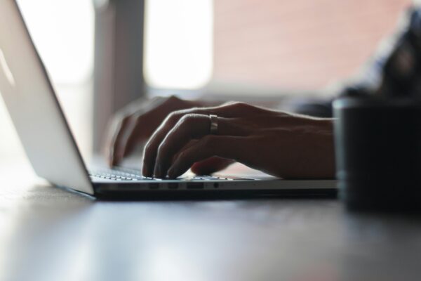 Person Typing on a Laptop