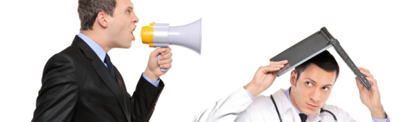 Businessman shouting into a megaphone while other businessman hides under a laptop.