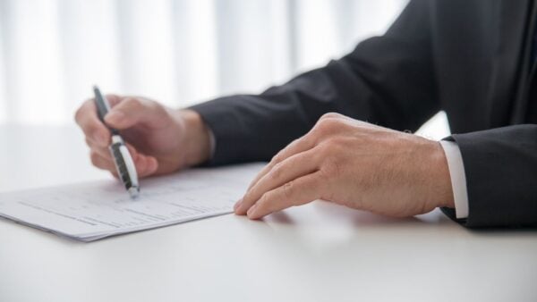 A professional signing business formation documents for a medical practice