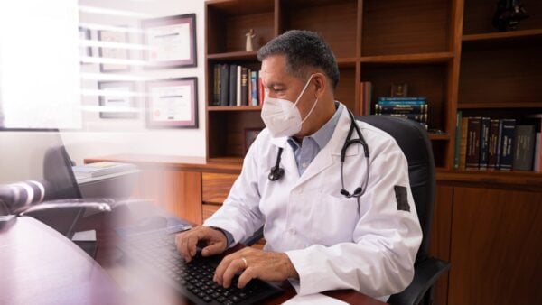 Physician owner working at the practice, balancing clinical and administrative demands of running a business