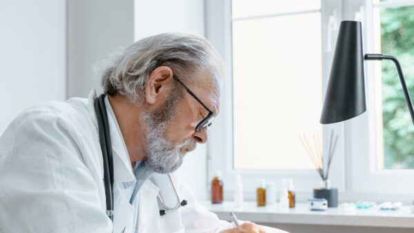 Physician working in a professional office, planning the next phase of practice growth