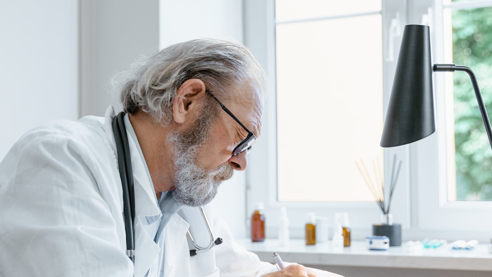 Physician working in a professional office, planning the next phase of practice growth