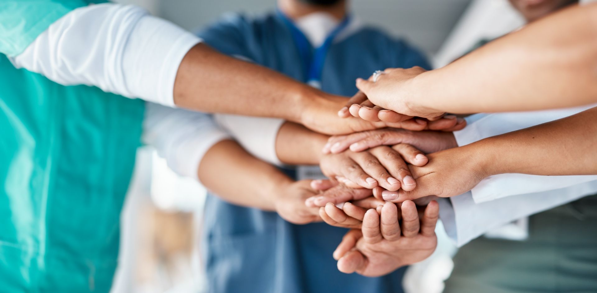 Doctors Putting Their Hands Together