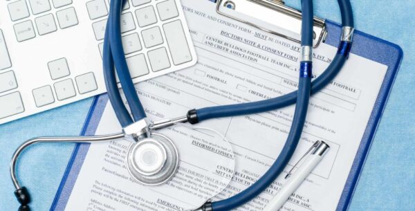 stethoscope laying over documentation