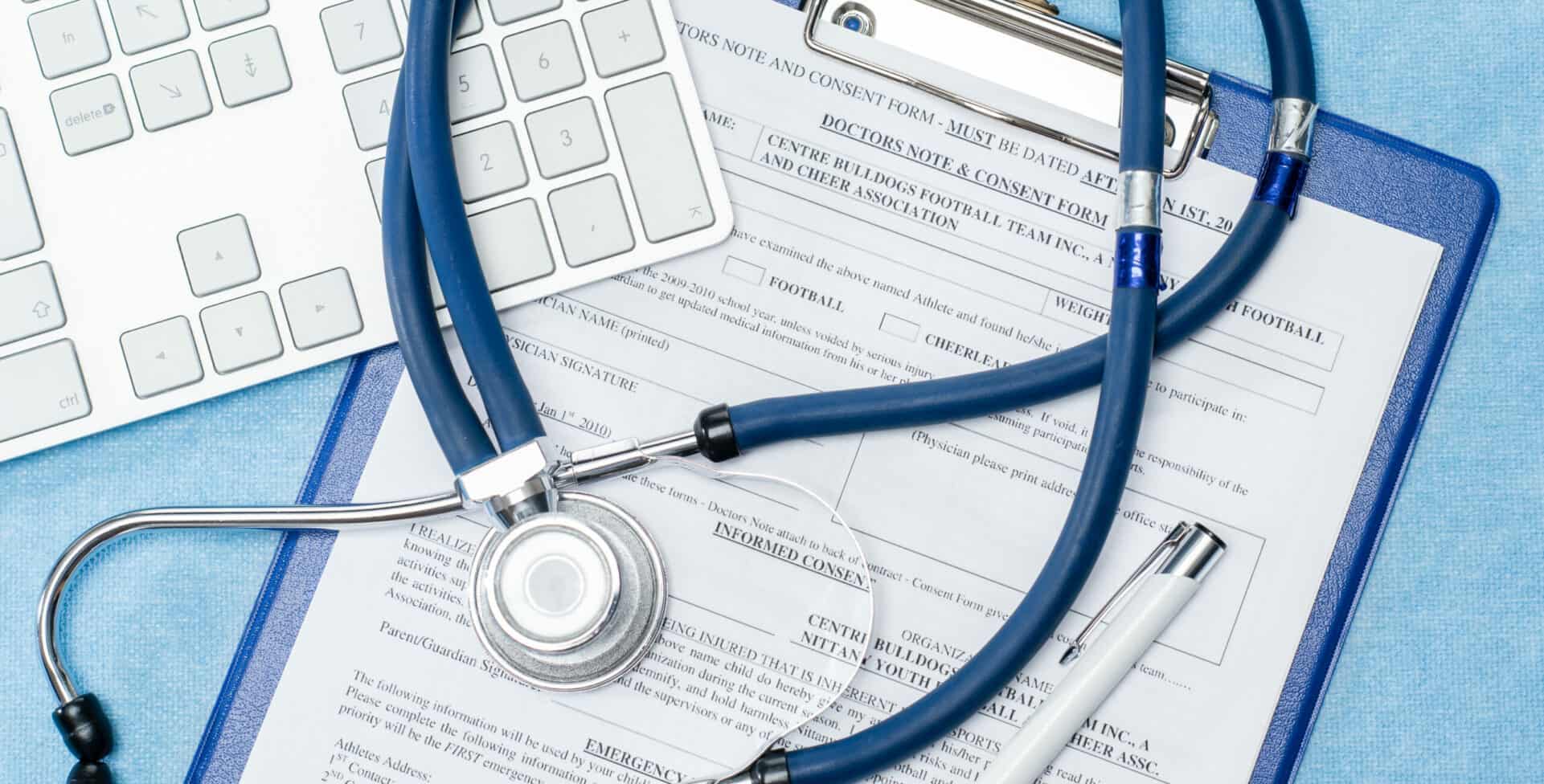 stethoscope laying over documentation