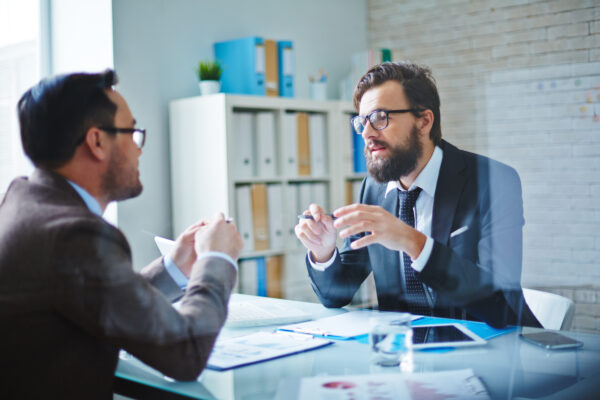 two men consulting